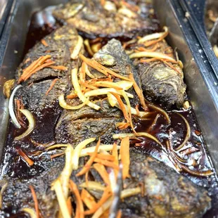 a close up of fish in a pan