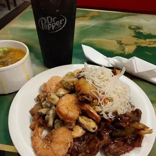 Fried shrimp, vermicelli, mussels,fried chicken wing,pepper steak,egg drop soup,and pepsi.