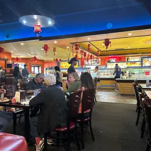 A picture of the rude manager walking up to where you pay in the gray shirt, the hat with a ball cap on he is tall