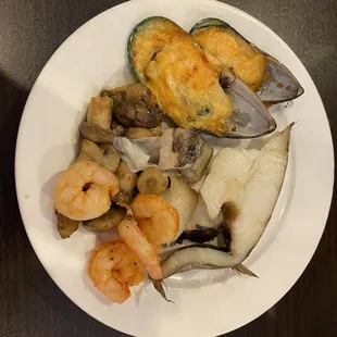 a plate of seafood and shrimp