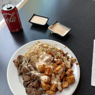 Part steak (medium rare) that is surprisingly super tender and flavorful + part spicy chicken- really moist and delicious!!!