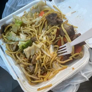 a close up of a take out container of food