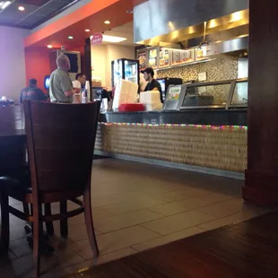 Look closely.....:guy has BOTH earbuds in while taking an order!