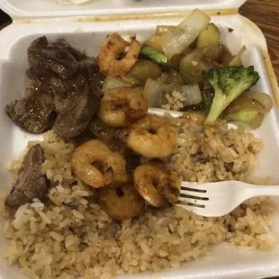 a close up of a meal in a styrofoam container
