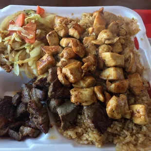 Chicken and steak with fried rice and cabbage