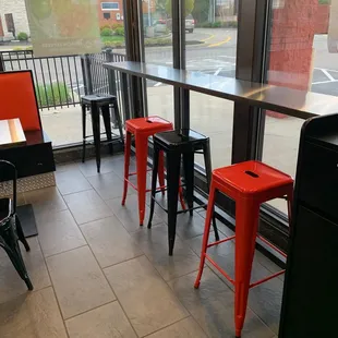 Seating along the long side of the restaurant