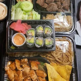 Chicken and steak bento boxes and a side of California rolls. $26