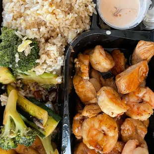 Hibachi entree chicken and shrimp, fried rice and vegetable and yummy sauce