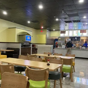 Creatively spaced tables. Order at the counter.