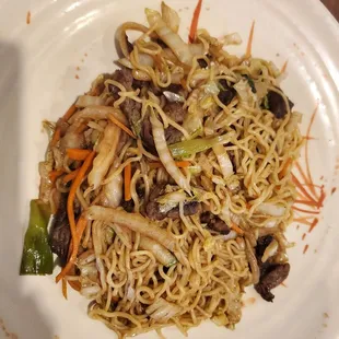a plate of noodles and vegetables