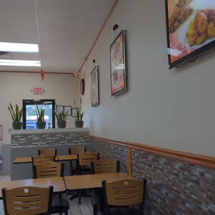a dining area with tables and chairs