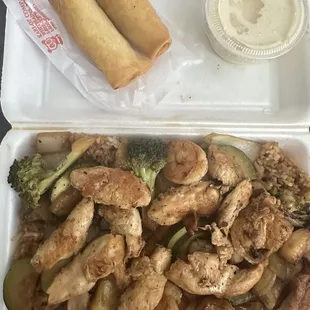 chicken and vegetables in a styrofoam container