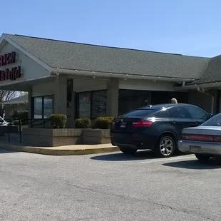 cars parked in front of the restaurant