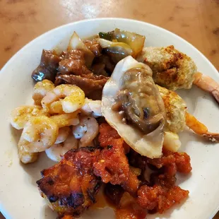 Potsticker, Stuffed Shrimp, cajun shrimp and spicy chicken along with pepper steak.