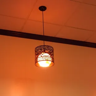 Cool lighting fixtures in the clean dining area.