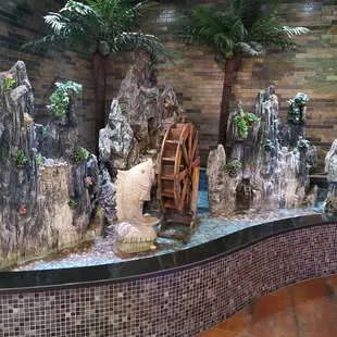 a polar bear in a water wheel