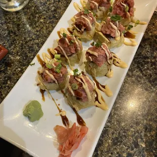 a plate of sushi rolls