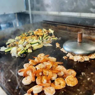 shrimp and zucchini being cooked