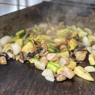 chopped vegetables being cooked
