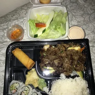 a tray of asian food