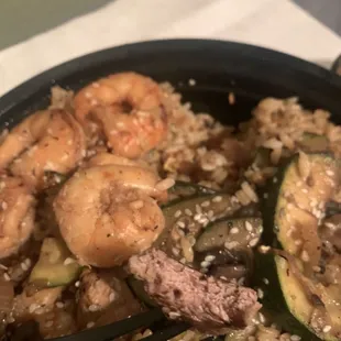 Med well filet, shrimp, veggies, rice. Good stuff. Quality.