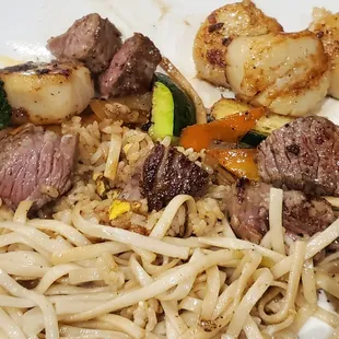 Steak and scallops. A bit overwhelmed by oil.