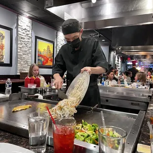 a chef preparing food in a restaurant
