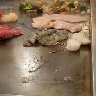 The various meats in progress.