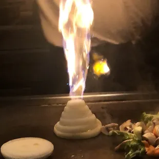 a flame coming out of the grill