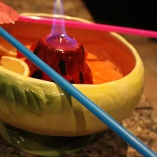 a bowl of food and chopsticks