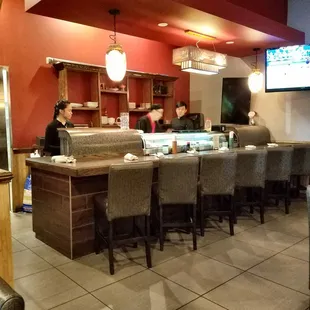 Sushi chef preparing Sushi dishes.
