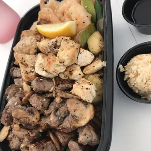 Steak , chicken , and shrimp trio