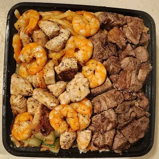 Shrimp, steak and chicken.