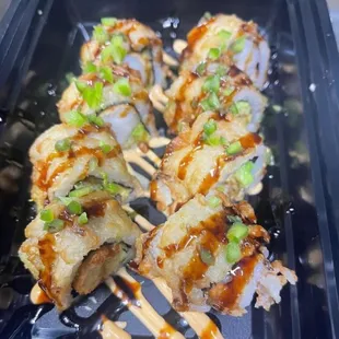 Crunchy shrimp roll 
IN: shrimp, avocado, cucumber and spicy mayo
OUT: eel sauce, sriracha and sesame seeds