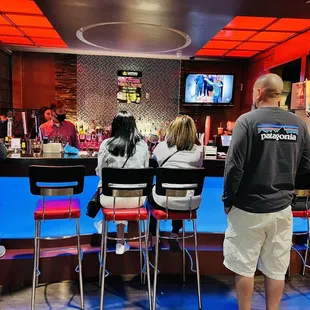 people sitting at the bar