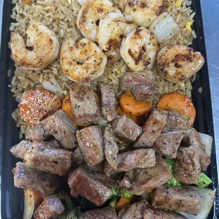 Come try our chicken and steak duo with fried rice and veggies