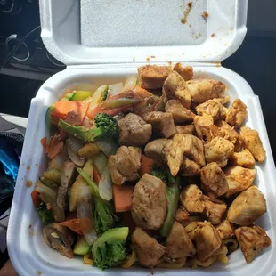 a container of chicken and vegetables