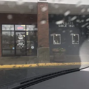 a view of a building through a windshield