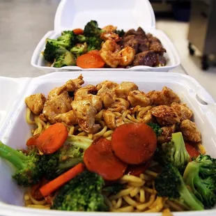 two take out containers of food