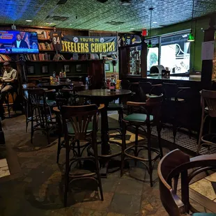 a bar with tables and chairs