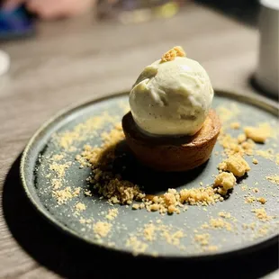 Dessert: miso caramel bar topped with black pepper ice cream and injeolmi sauce