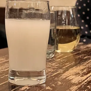 Cloudy house sake and a white wine.