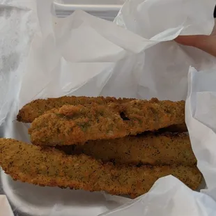 a basket of fried fish sticks