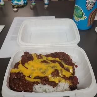 Chili and rice topped with cheese