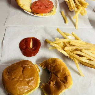 a hamburger, fries, and ketchup