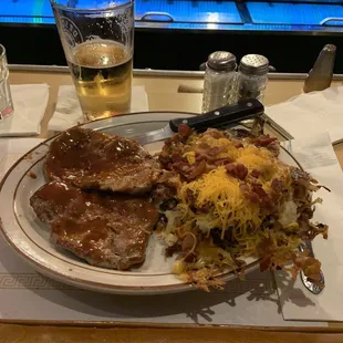 Tenderloin dinner with bbq sauce. Crispy hash browns with onion, bacon and cheese. Amazing!