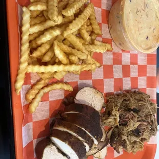 Pulled pork, chicken, French fries and Cajun cole slaw