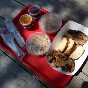 three meat sampler with tots and Cajun slaw