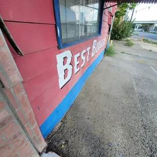 the best burger sign on the side of the building