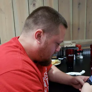 Eating food with my brother.